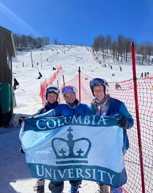 Members of Columbia's Ski and Snowboard Club with CU flag