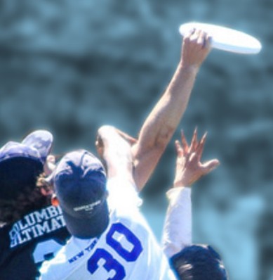 A player from Uptown Local, Columbia's Ultimate Frisbee Team, outmaneuvers two competing players to successfully catch a frisbee in mid-air.